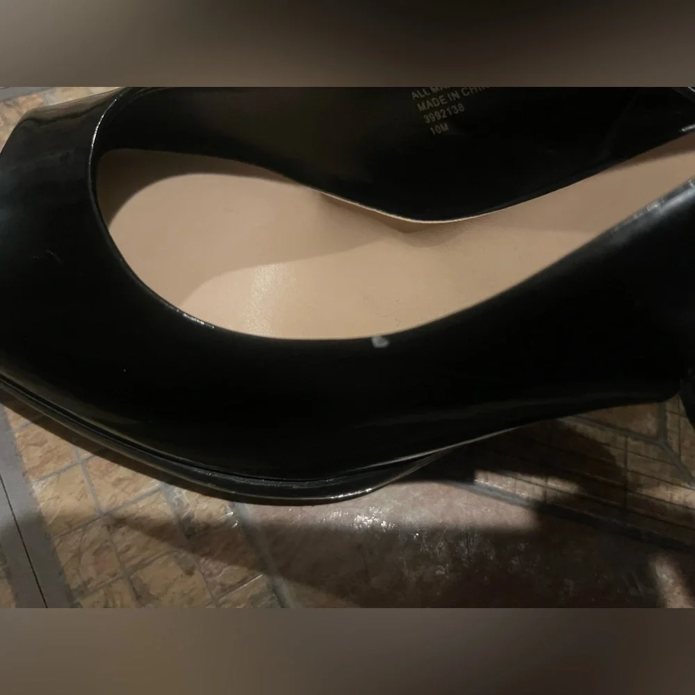 Coach and four Black heels
